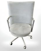 A Danish Erik Jorgensen designed Partner chrome framed executive swivel armchair in pale blue suede