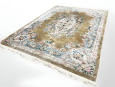 A good quality Chinese gold carpet, 267 cm x 366 cm.