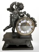 A Victorian black slate and patinated metal figural mantle clock,