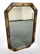 An Edwardian oak octagonal bevelled glass mirror, length 77 cm.