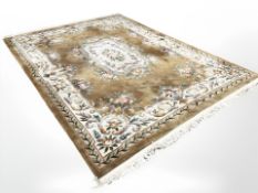 A good quality Chinese gold carpet, 267 cm x 366 cm.