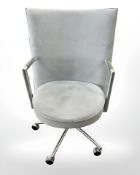A Danish Erik Jorgensen designed Partner chrome framed executive swivel armchair in pale blue suede