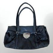 Prada : A black leather and nylon shoulder bag.
