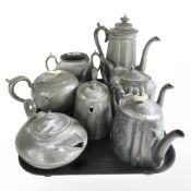 A group of 19th century pewter tea and coffee pots.