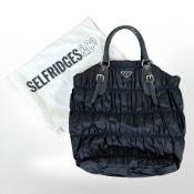 Prada : A black nylon Tessuto Gaufre tote bag, with authenticity card, numbered BN 1611,