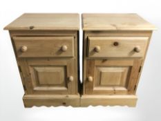 A pair of pine bedside cupboards,