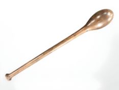 A vintage wooden juggler's baton, length 65 cm.