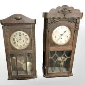 Two early 20th century oak wall clocks.