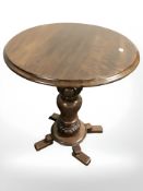 A reproduction circular occasional table, height 59 cm.