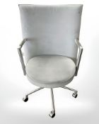 A Danish Erik Jorgensen designed Partner chrome framed executive swivel armchair in pale blue suede