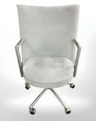A Danish Erik Jorgensen designed Partner chrome framed executive swivel armchair in pale blue suede