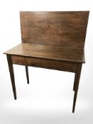 A 19th century oak tea table, width 91 cm.