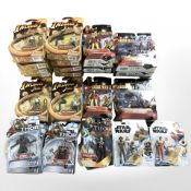Thirty one Marvel figurines, including Indiana Jones, Thor, Star Wars and Iron Man, all boxed.
