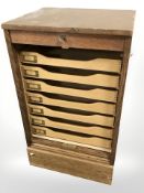 An Astrola tambour front pedestal filing cabinet, with key,