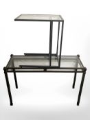 A metal and glass side table, width 112 cm, and a further similar table.