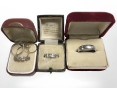 A silver Celtic band ring, a steel ring with engraved script to interior,