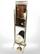 A brass cheval mirror and an oval mirror
