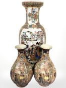 Three 20th century oriental earthenware ceramic vases, tallest 60 cm.