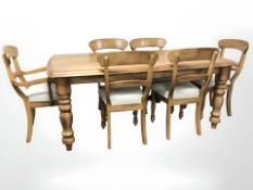 A contemporary stained wooden dining table, 180 cm x 105 cm x 75 cm,