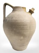 A large earthenware flagon, height 40 cm.