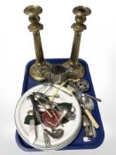 An ornate pair of cast brass candlesticks, silver plated and pewter wares,