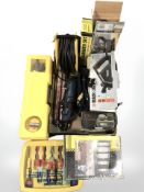 A group of tools and hardware including Black and Decker sander, laser level, electrical tool set,