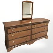A Stag six drawer chest, with mirror,