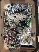 A quantity of modern costume jewellery including bead necklaces, faux pearls, bangles, etc.