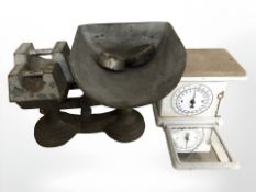 An antique cast iron personal scale and a further set of scales with various weights.