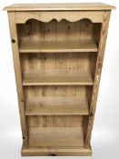 A contemporary pine open bookcase,