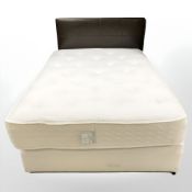 A Barker & Stonehouse 4'6 storage divan with mattress and leather headboard