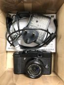 A Fujifilm X-10 camera, with Super EBC F=7.1-28.