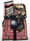 A collection of 19th century embroidered items including ceremonial hats,