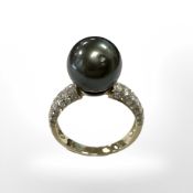 A 14ct gold diamond and Tahitian pearl ring, the total diamond weight 0.61ct, size L.