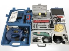 A group of boxed tools including Black and Decker jigsaw, multi purpose grinder, socket sets, etc.