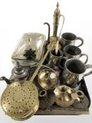 A group of pewter tankards, Indian brass coffee pot, various candlesticks and other metalwares.