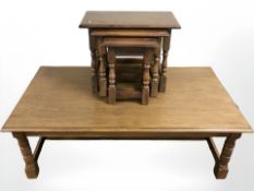 A reproduction oak rectangular coffee table, length 140 cm, and a nest of three tables.