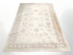 A machine made rug of Zeigler design, 267 cm x 180 cm.
