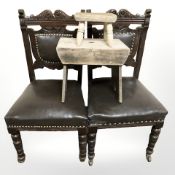 A pair of carved oak dining room chairs,