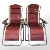 A pair of Quest Elite folding garden loungers