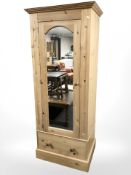 A contemporary pine mirrored single door wardrobe, 78 cm x 55 cm x 190 cm.
