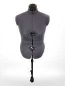 An adjustable dress maker's mannequin torso