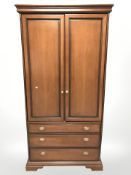 A Stag double door wardrobe fitted drawers beneath,