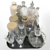 A group of drinking glasses and bottles, chemists bottle marked Alcool, stoneware hot water bottle,