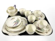 A twenty one piece Crown Staffordshire tea set with hand painted floral decoration.
