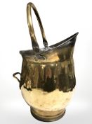 A Victorian brass swing handled coal bucket, height 48 cm.