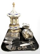 A musical ceramic cigarette dispenser on gilt brass paw feet, assorted cutlery, EPNS cigarette box,