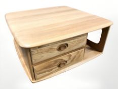 An Ercol stained elm Pandora's Box coffee table, width 80 cm.