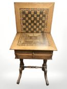 An inlaid oak games / sewing table, width 52 cm.