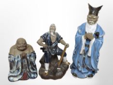 Three 20th-century Chinese earthenware figures, tallest 33cm.